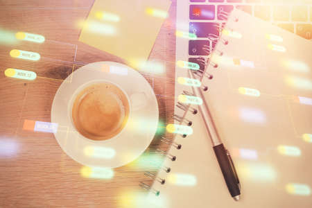 Double exposure of data drawing hologram over topview of study desk background with computer. Concept of Ai.の写真素材