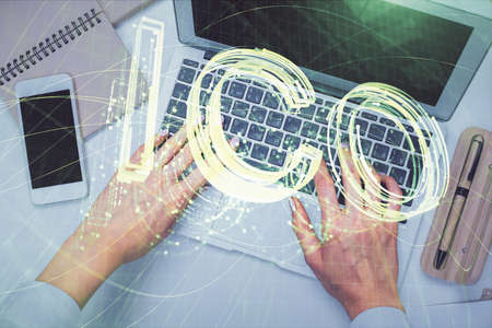 Double exposure of woman hands working on computer and blockchain theme hologram drawing. Top View....