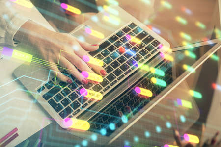 Multi exposure of woman hands working on computer and data theme hologram drawing. Tech concept.