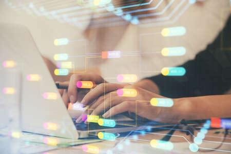 Multi exposure of woman hands working on computer and data theme hologram drawing. Tech concept.の写真素材