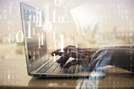 Double exposure of woman hands working on computer and data theme hologram drawing. Tech concept.