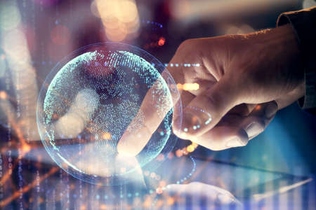 Multi exposure of man's hands holding and using a digital device and map drawing. International business concept.の写真素材