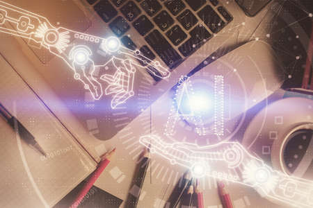 Double exposure of data drawing hologram over topview of study desk background with computer. Concept of Ai.の写真素材