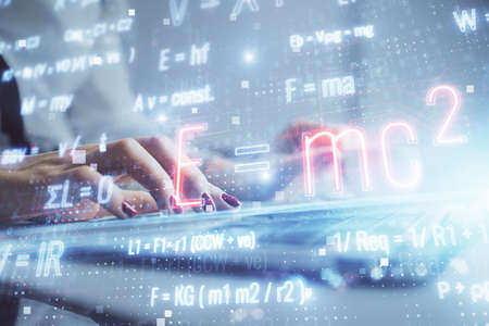 Double exposure of woman hands typing on computer and formula hologram drawing. Education concept.