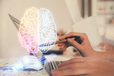 Multi exposure of woman hands working on computer and brain hologram drawing. Ai concept.