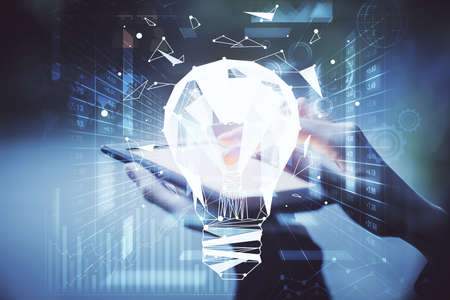 Double exposure of light bulb hologram and woman holding and using a mobile device. Idea concept.の写真素材