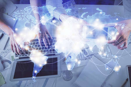 Double exposure of man and woman working together and business theme hologram drawing. Computer...
