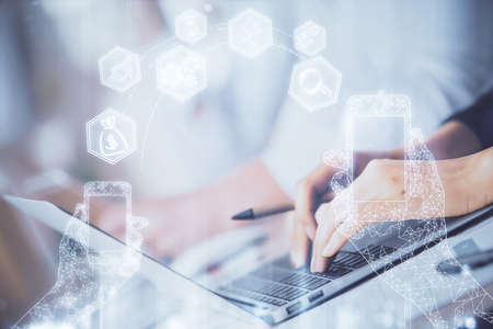 Double exposure of woman hands typing on computer and technology theme drawing. High Tech concept.