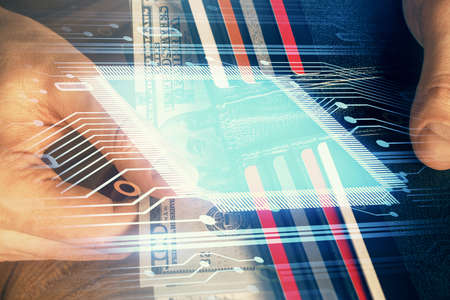 Double exposure of technology drawing hologram and us dollars bills and man hands. Data concept