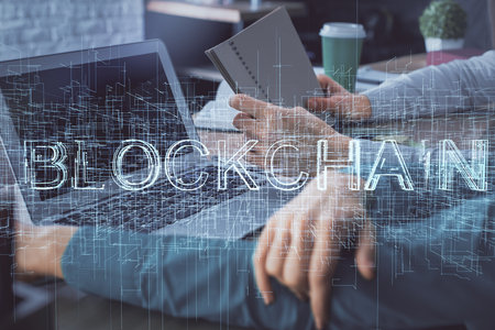 Double exposure of man and woman working together and crypto finance theme hologram. Blockchain...