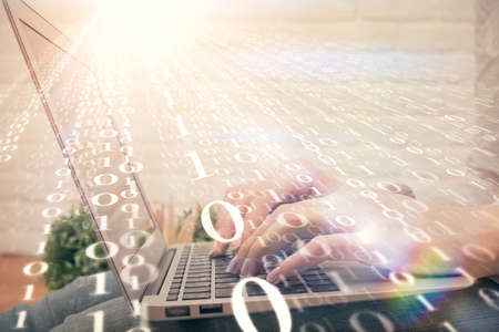 Double exposure of woman hands working on computer and data theme hologram drawing. Tech concept.