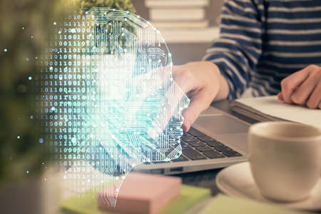 Double exposure of woman hands working on computer and brain hologram drawing. Ai concept.