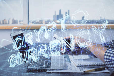 Double exposure of man's hands holding and using a phone and crypto currency blockchain theme drawing.の写真素材
