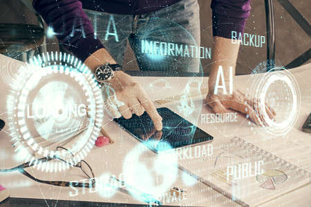 Double exposure of man's hand holding and using a digital device and data theme drawing. Technology concept.の写真素材