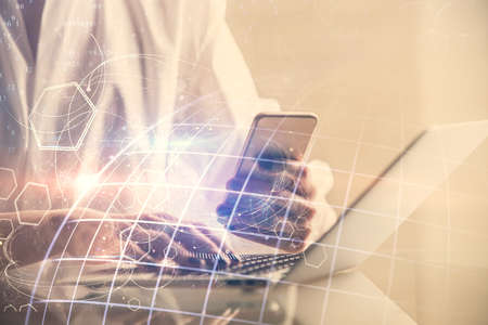 Double exposure of map sketch hologram and woman holding and using a mobile device.
