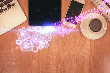 Double exposure of technology theme drawing over work table desktop. Top view. Global data analysis concept.の写真素材