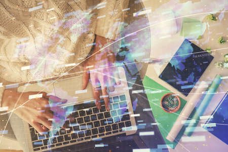 Double exposure of woman hands working on computer and data theme hologram drawing. Top View....