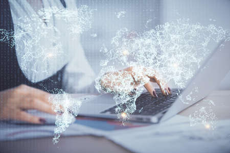 Double exposure of woman hands typing on computer and social network theme hologram drawing. People media concept.の写真素材