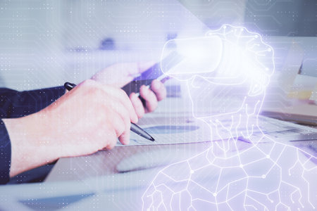 Double exposure of man's hands holding and using a digital device and AR glasses drawing. Virtual reality concept.の写真素材