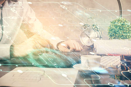 Multi exposure of man's hands holding and using a digital device and data theme drawing. Innovation...