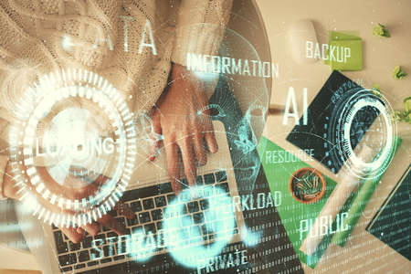 Double exposure of woman hands working on computer and data theme hologram drawing. Top View....