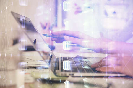 Multi exposure of woman hands working on computer and data theme hologram drawing. Tech concept.