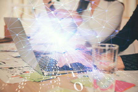 Double exposure of woman hands working on computer and data theme hologram drawing. Tech concept.の写真素材