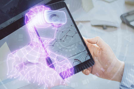 Double exposure of man's hands holding and using a digital device and AR glasses drawing. Virtual...