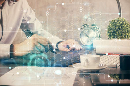 Multi exposure of man's hands holding and using a digital device and data theme drawing. Innovation concept.の写真素材