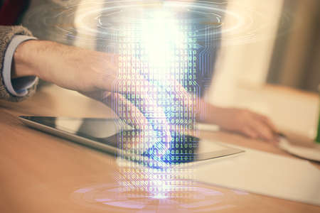 Double exposure of data theme hologram drawing and man and woman working together holding and using...