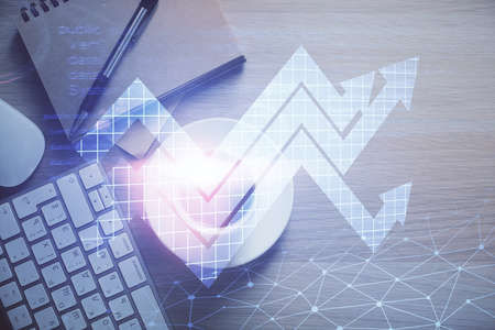 Double exposure of arrows drawing and work table top veiw. Concept of growth.