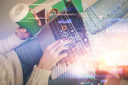 Double exposure of woman hands working on computer and data theme hologram drawing. Tech concept.