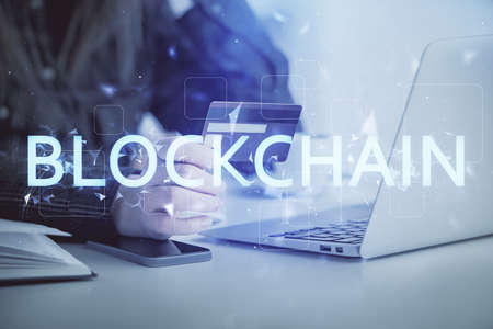 Multi exposure of woman on-line shopping holding a credit card and crypto theme drawing. Blockchain...