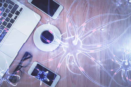 Double exposure of neuron drawing over table with phone. Top view. Science education concept.