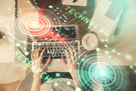 Double exposure of woman hands working on computer and data theme hologram drawing. Top View....