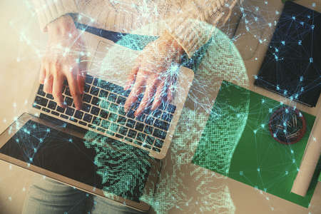 Double exposure of woman working on computer andhuman brain hologram drawing. Top View. Ai concept.の写真素材