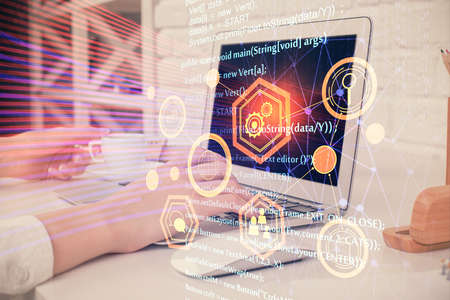 Double exposure of woman hands working on computer and data theme hologram drawing. Tech concept.