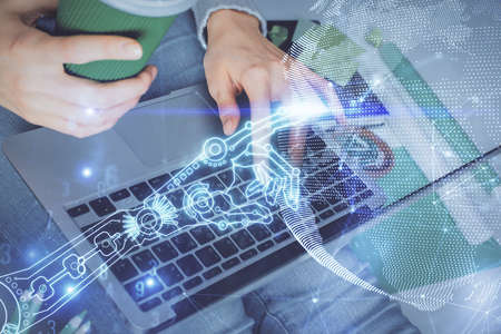 Double exposure of woman hands typing on computer and technology theme drawing. High Tech concept.