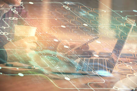 Multi exposure of man's hands holding and using a digital device and data theme drawing. Innovation...