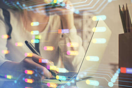Multi exposure of woman hands working on computer and data theme hologram drawing. Tech concept.