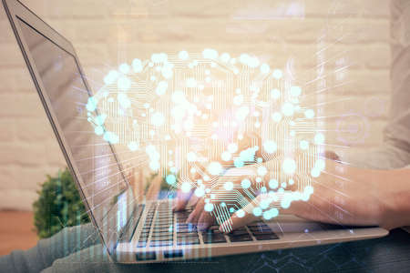 Multi exposure of woman hands working on computer and brain hologram drawing. Ai concept.の写真素材