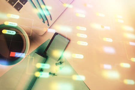Multi exposure of data drawing hologram over topview of study desk background with computer. Concept...