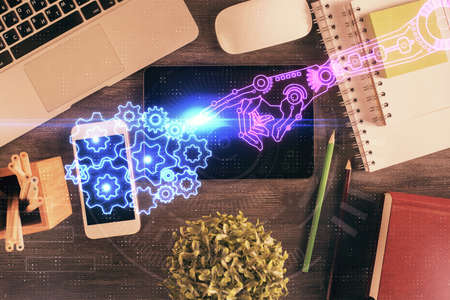 Double exposure of technology theme drawing over work table desktop. Top view. Global data analysis...
