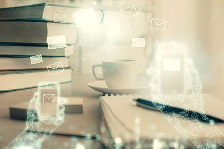 Double exposure of envelope drawing and desktop with coffee and items on table background. Concept...