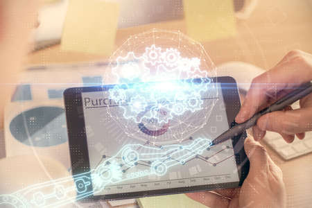 Multi exposure of man's hands holding and using a digital device and data theme drawing. Innovation...