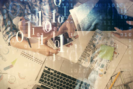 Double exposure of data theme hologram drawing and man and woman working together holding and using...