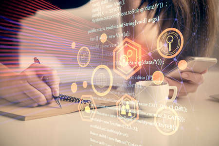 Double exposure of technology sketch hologram and woman holding and using a mobile device.