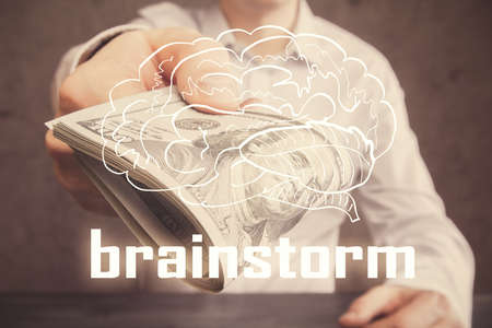 Multi exposure of creative drawing hologram and USA dollars bills and man hands. Start up conceptの写真素材