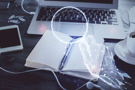 Double exposure of start up theme drawings and desk with open notebook background.