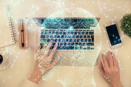 Double exposure of woman working on computer andhuman brain hologram drawing. Top View. Ai concept.